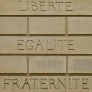 French motto liberte egalite fraternite on a brickwall
